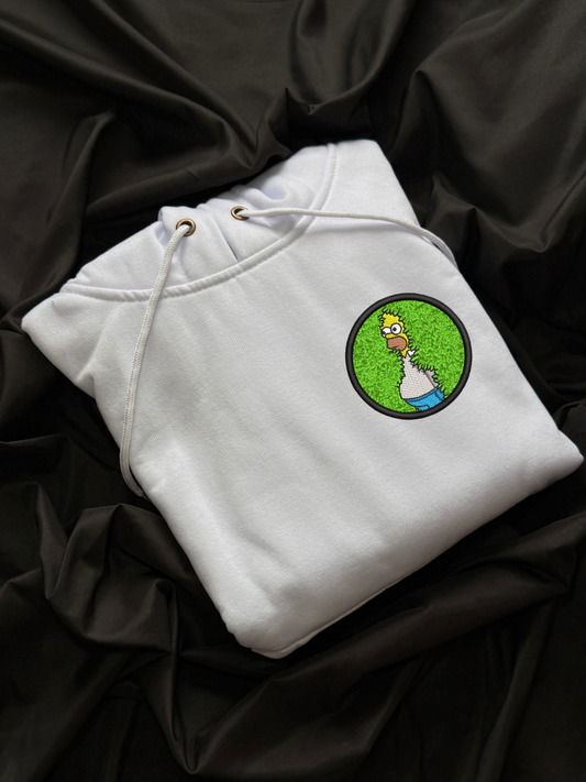 Hoodie Homero Simpson desaparece en el cesped circular bordado