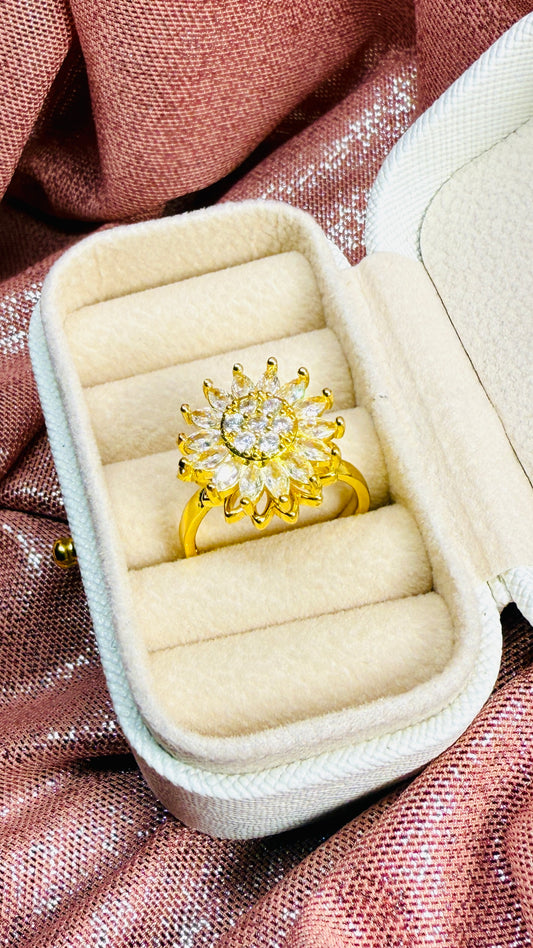 Anillo girasol dorado giratorio