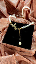 Collar mariposa y perlas
