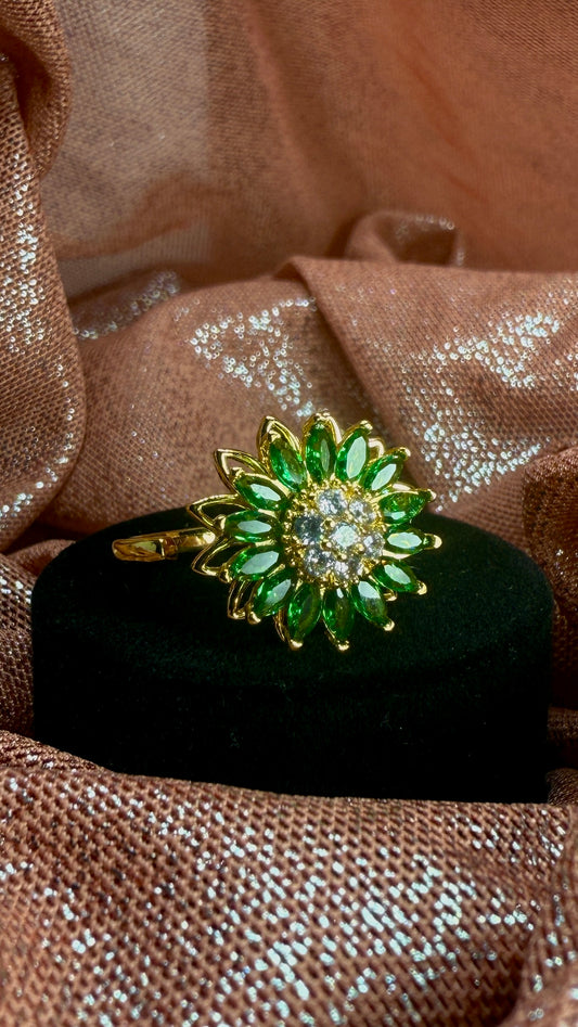 Anillo girasol verde giratorio