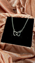 Collar corazones cruzados plateado